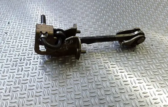 Front door check strap stopper