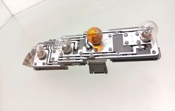 Tail light bulb cover holder