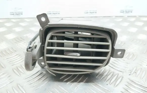Nissan Almera Tino Dash center air vent grill 68760BU200