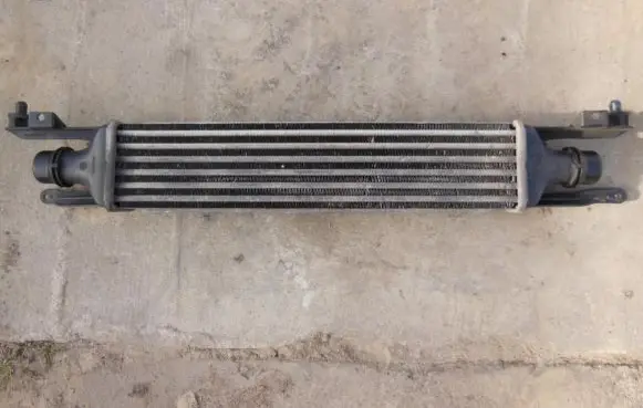 Opel Corsa D Intercooler radiator 872051000
