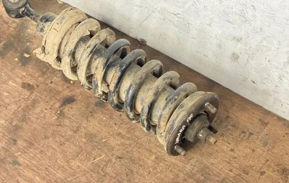 Nissan Navara D40 Front shock absorber with coil spring