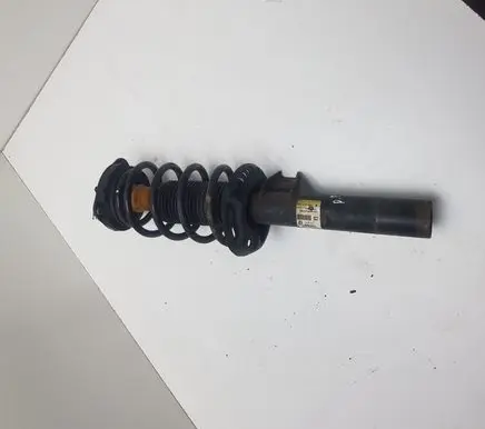 Volkswagen PASSAT B7 USA Front shock absorber with coil spring 561413031K