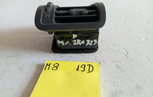 Mazda 323 Dashboard side air vent grill/cover trim 65965656
