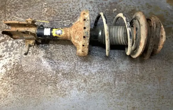 Subaru Outback Front shock absorber with coil spring 614024JP