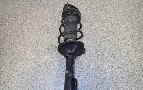 Toyota Yaris Front shock absorber with coil spring