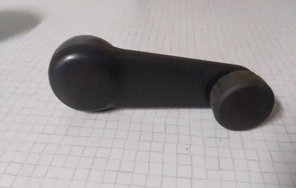 Nissan Primera Rear door window winding handle 