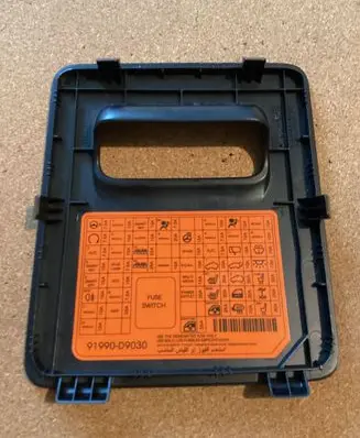 KIA Sportage Fuse box cover 91990D9030