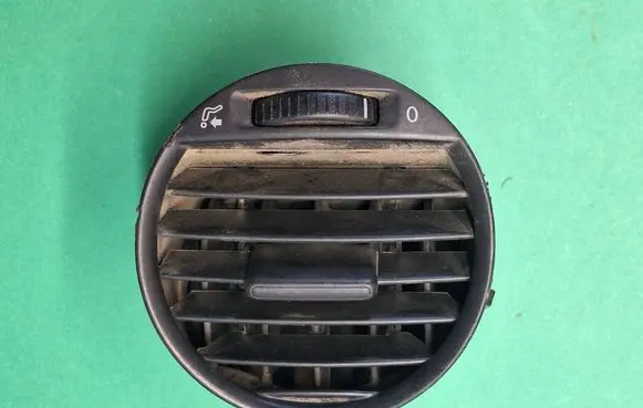 Volkswagen Caddy Dash center air vent grill 2K0819703B