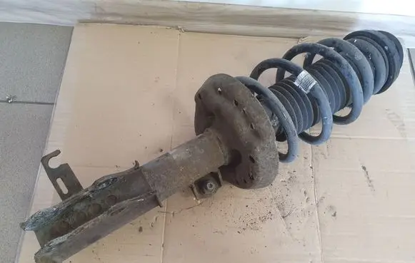 Opel Astra J Front shock absorber with coil spring 13354013