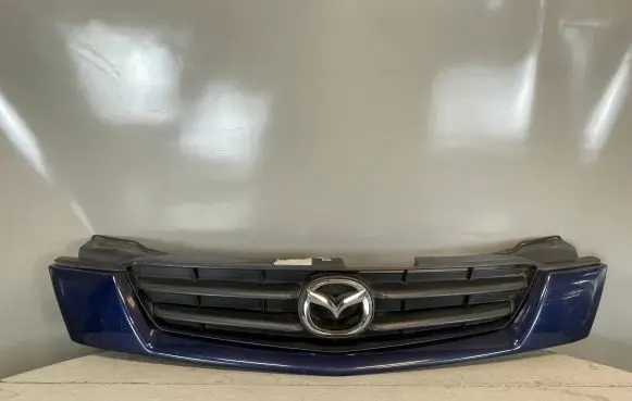 Mazda Demio Front bumper upper radiator grill DC3550712