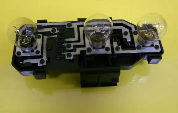 Tail light bulb cover holder