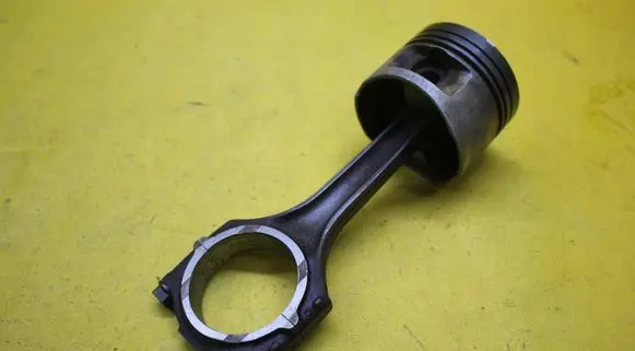 Piston with connecting rod