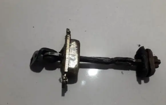 Rear door check strap stopper