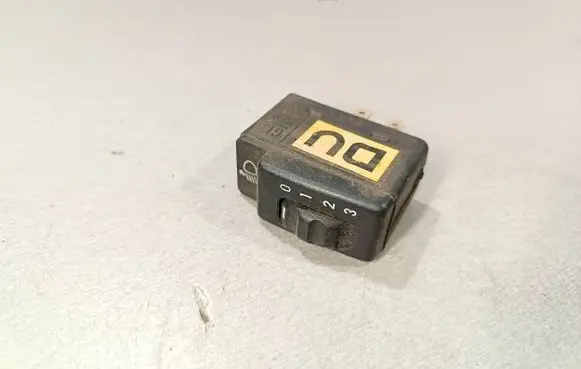Headlight level height control switch