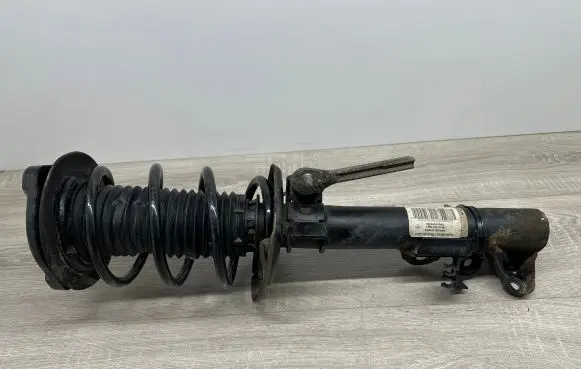 Mercedes-Benz E C207 W207 Front shock absorber with coil spring A2043202866