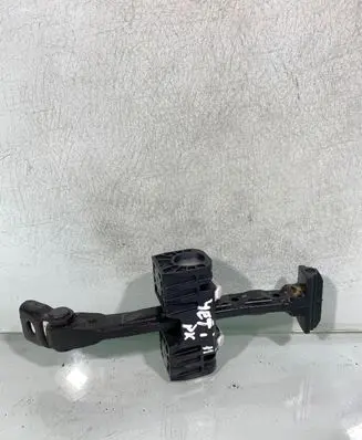 Front door check strap stopper
