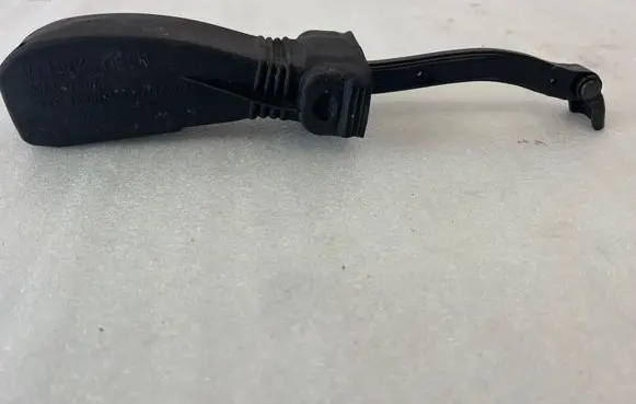 Front door check strap stopper