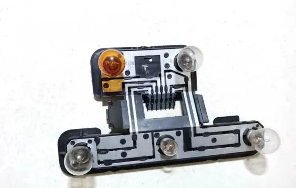 Tail light bulb cover holder