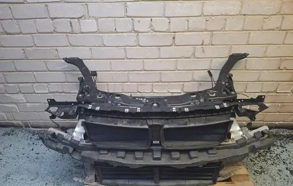 Radiator support slam panel