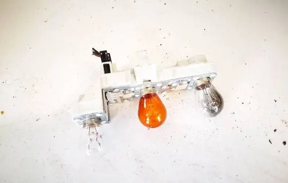 Tail light bulb cover holder
