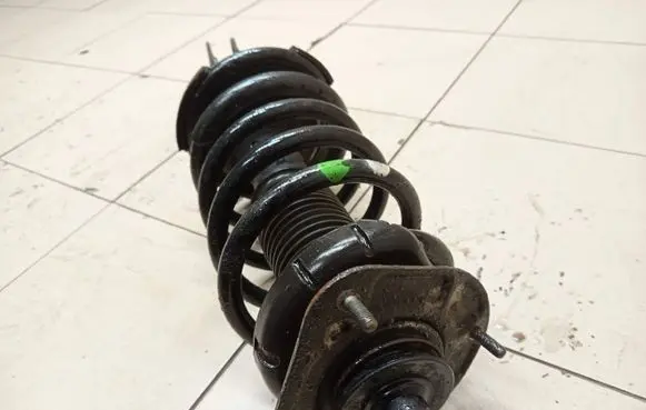 Front shock absorber with coil spring