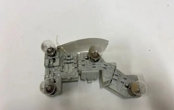 Volvo V50 Tail light bulb cover holder