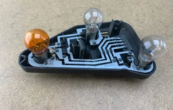 BMW X3 E83 Tail light bulb cover holder 63213418439 3418439 63213414399