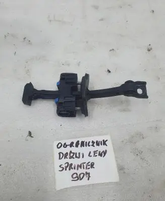 Front door check strap stopper