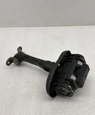 Front door check strap stopper
