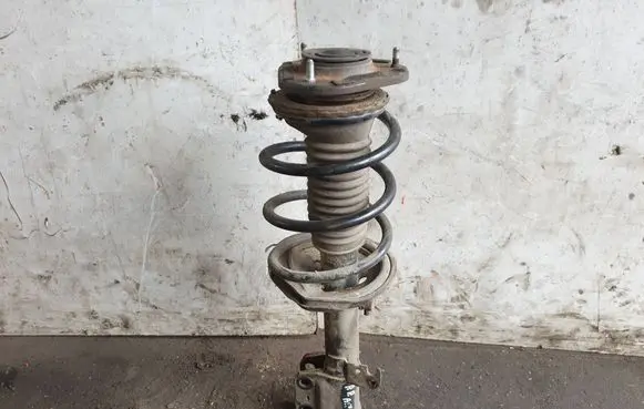 Front shock absorber with coil spring