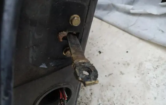 Front door check strap stopper