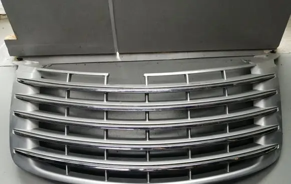 Chrysler PT Cruiser Front bumper upper radiator grill 30121040803 272WS2AC