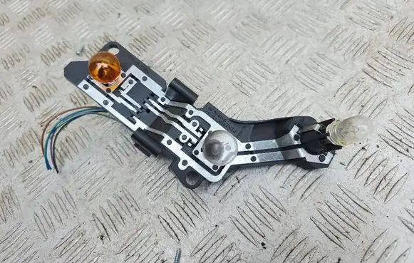 Tail light bulb cover holder