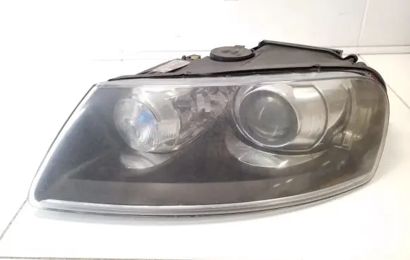 Volkswagen Touareg I Headlight/headlamp 7L6941015AM