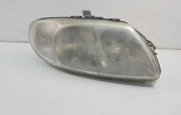 Chrysler Grand Voyager IV Headlight/headlamp 04857702ABF