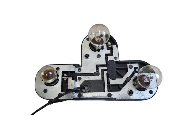 Tail light bulb cover holder