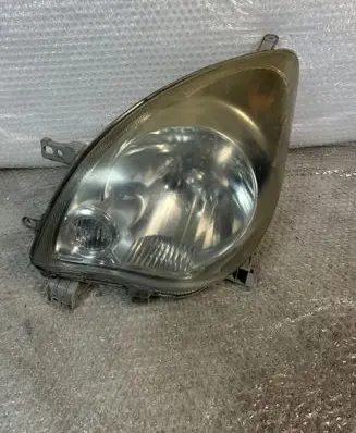 Daihatsu Cuore Headlight/headlamp 10051873