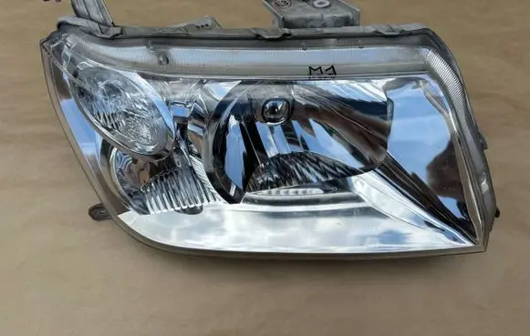 Suzuki Grand Vitara II Headlight/headlamp 10059076