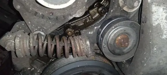 Opel Astra J Generator/alternator belt tensioner 