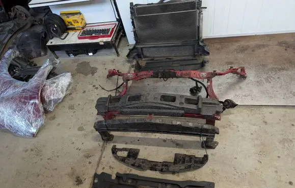 Radiator support slam panel