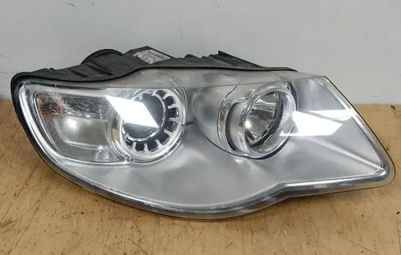 Volkswagen Touareg I Headlight/headlamp 7L6941032A 1LL24703204