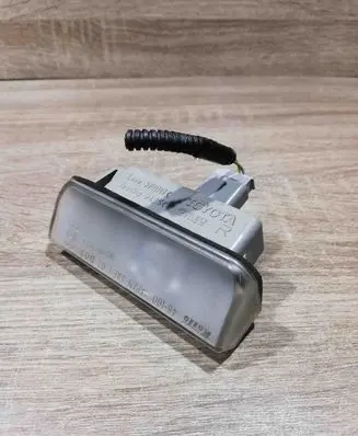 Toyota Avensis T250 Number plate light 48100 L07DOT KOITO