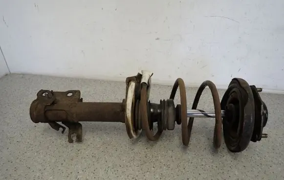 Nissan Almera Tino Front shock absorber with coil spring