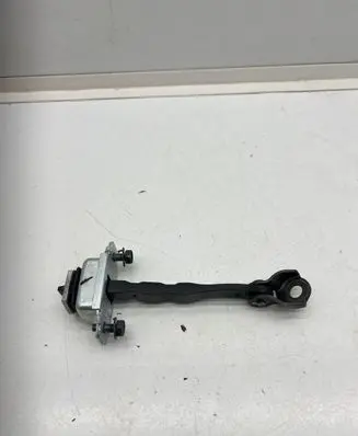 Front door check strap stopper