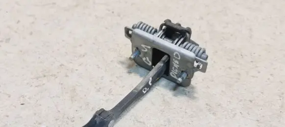Front door check strap stopper
