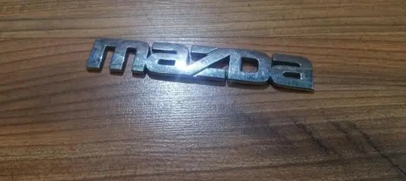 Mazda 323 Manufacturer badge logo/emblem 