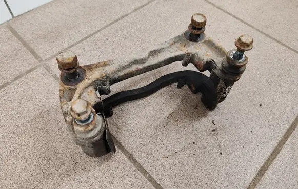 Subaru Legacy Front Brake Caliper Pad/Carrier 