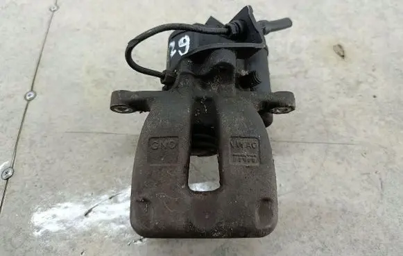 Volkswagen PASSAT B6 Rear brake caliper TRW