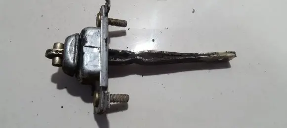 Front door check strap stopper
