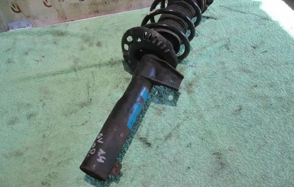 Volkswagen Golf V Front shock absorber with coil spring